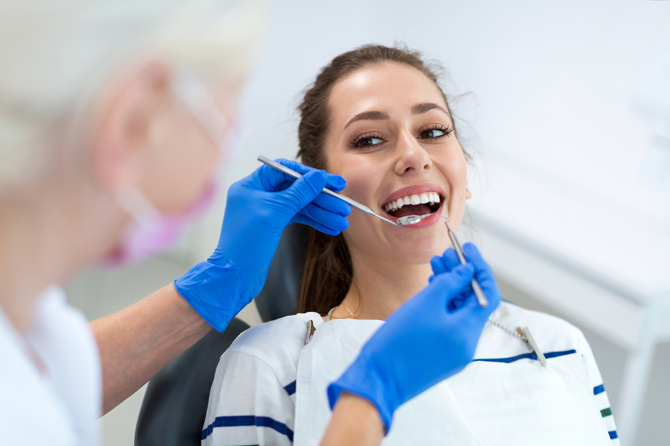 Dentist and patient in dentist office